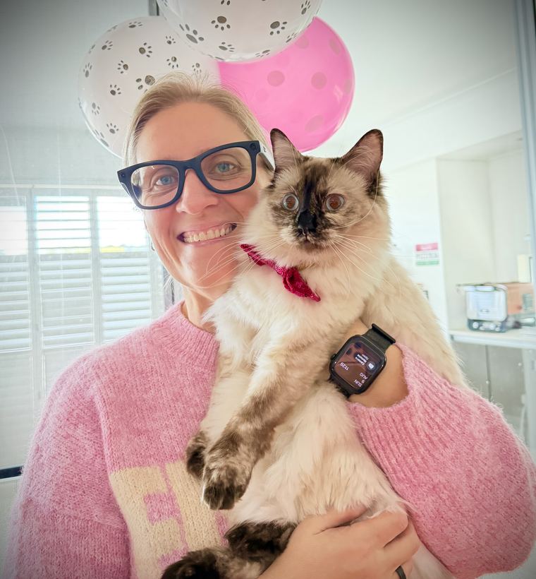 Tracy at her desk with Billie